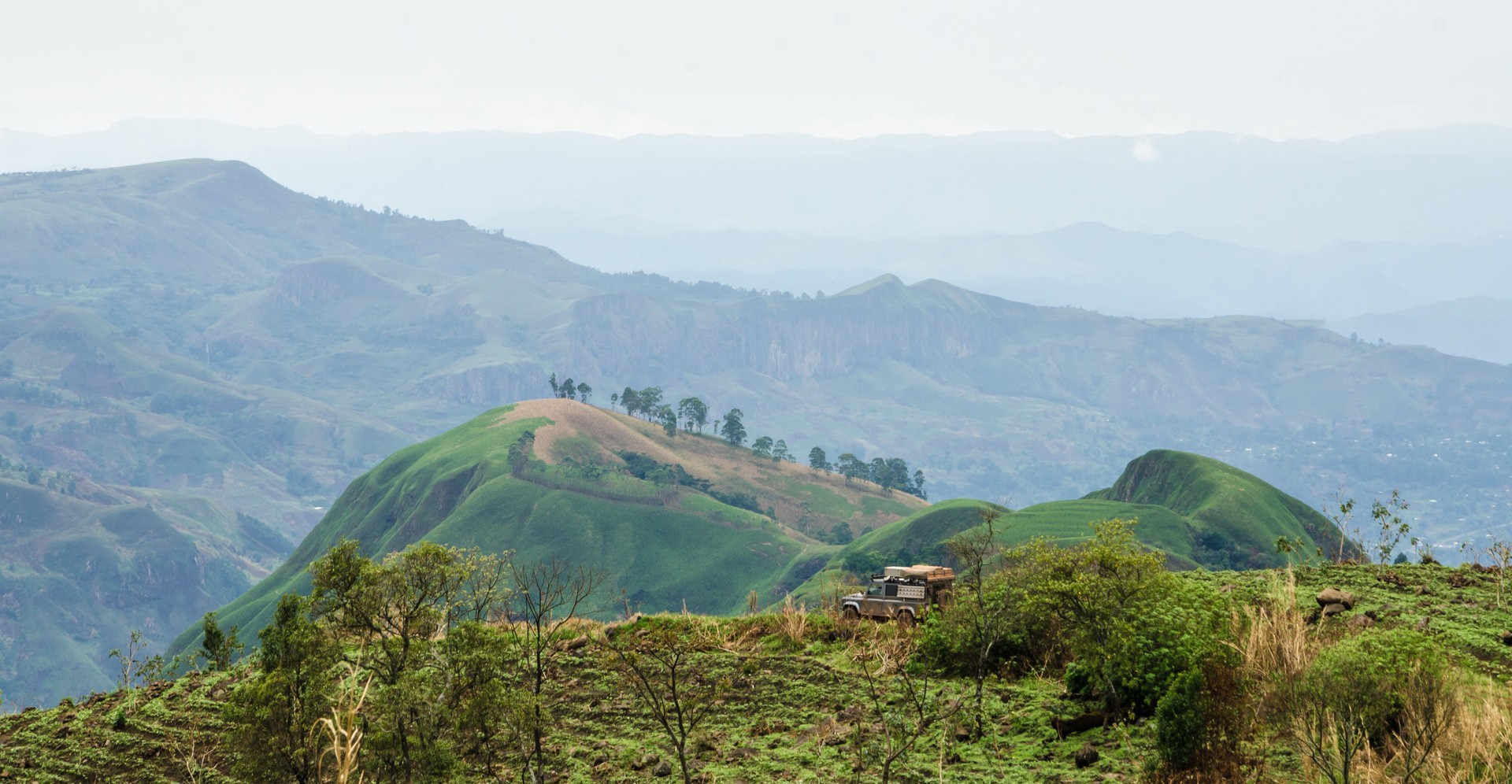 Scenic View Of Landscape And Mountains Against Sky